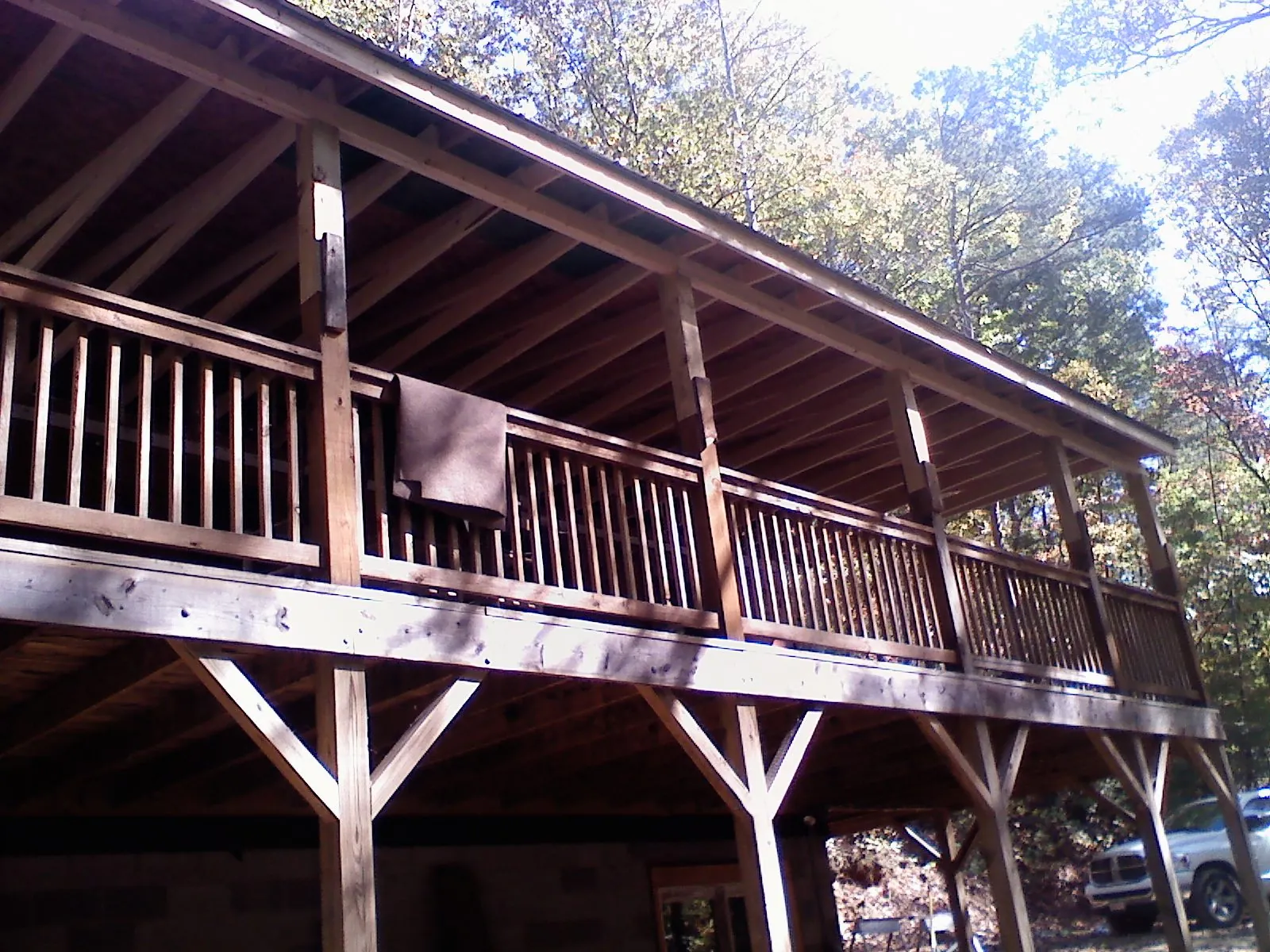 Timber framing under a new elevated porch and deck in Shafer